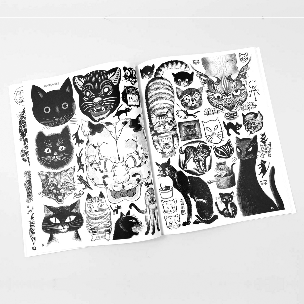 Open book displaying black and white cat illustrations on a light gray background