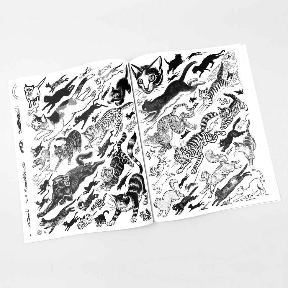 Open book with pages displaying black and white illustrations of cats on a light gray background