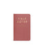 Pink notebook with 'Field Notes' branding on a white background