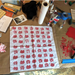 White cloth with red patterns on a messy worktable