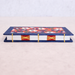 Book with floral design on cover and decorative spine stitch on light gray background