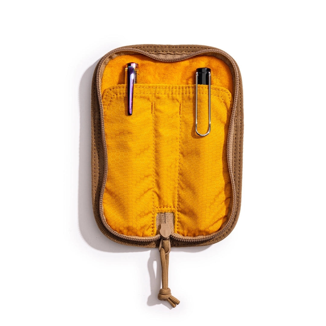 Lochby Duo Pen Pouch in olive color shown lying open with yellow interior and two sample pens (not included) show in pouches