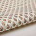 Roll of paper with a floral repeat pattern on a white background