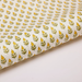 Paper with a repeat flower and leaf pattern on a white background