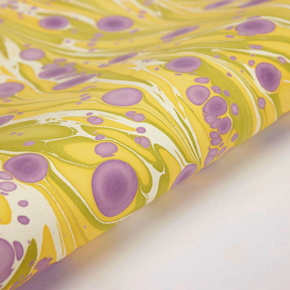 Handmade Indian Cotton Paper- Marbled Cosmos- yellow, white, green with purple circular patterns- detail