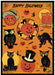 A completed greeting card jigsaw puzzle featuring a Halloween theme on an orange background, with jack-o'-lanterns, owls, a black cat, bats, spiderwebs, and the words 'Happy Halloween' at the top.