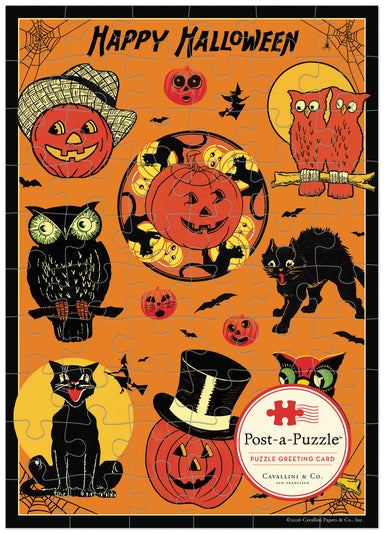Cavallini & Co. Halloween Puzzle Greeting Card- image showing a completed jigsaw puzzle featuring a Halloween theme with the text 'Happy Halloween' at the top. The design includes orange pumpkins, black cats, red owls, bats, spiderwebs, and a large central pumpkin on an orange background.