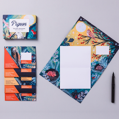 Pigeon brand letter writing kit featuring bird illustrations on a gray background shown with product packaging, a pen and one example open.