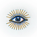 Decorative beaded brooch with an eye design on a white background