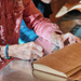 Medieval Leather Journal Class sample with student stitching in progress