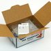 Open cardboard box with 'The Standard Wardrobe' label with packaging and invoice inside on a white background