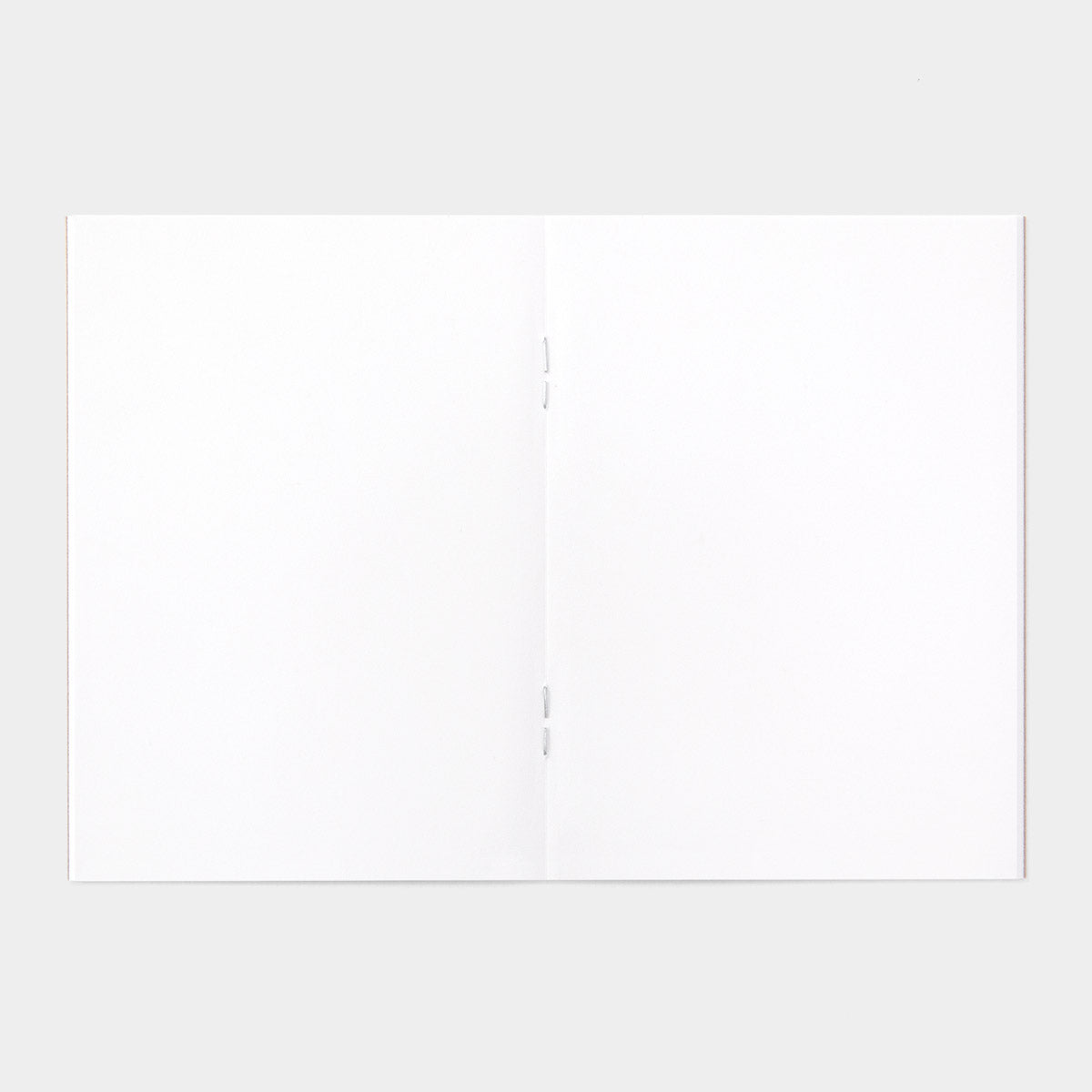 TRAVELER'S FACTORY Short Trip (ST) Passport Refill has half the number of pages (36 pages) of a Passport Size TRAVELER’S notebook refill, perfect for a short trip! 