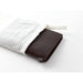 The passport starter kit features a brown leather cover, a blank notebook refill, a spare rubber band, and a cotton case.