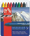 A set of Caran d'Ache Neocolor II water soluble pastels in a tin, with a mountainous landscape in the background.