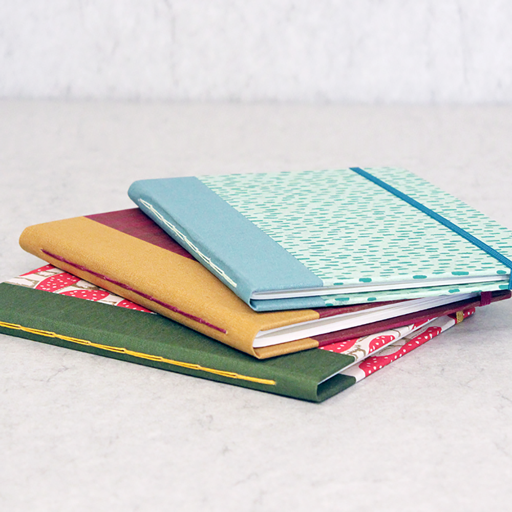 Totebook with Watercolor Paper class samples- 3 different cover examples stacked