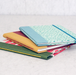 Totebook with Watercolor Paper class samples- 3 different cover examples stacked