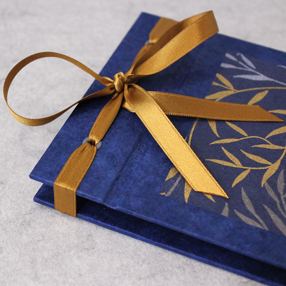 Archival Photo Book - Japanese Stab Binding class sample with gold ribbon