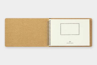 The Traveler's Company Spiral Ring Notebook is the perfect place to store your mementos. The spiral notebook is reminiscent to the classic manilla notebook but with a twist- a window to see what is stored inside. 